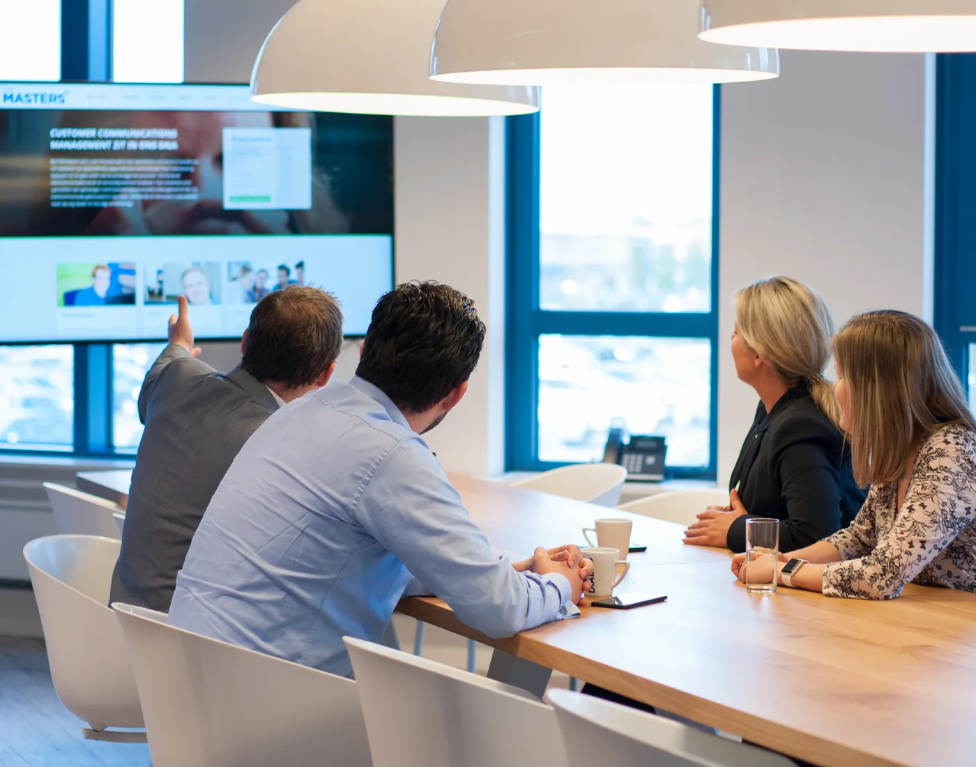 Dialog Group colleagues working together in a European office